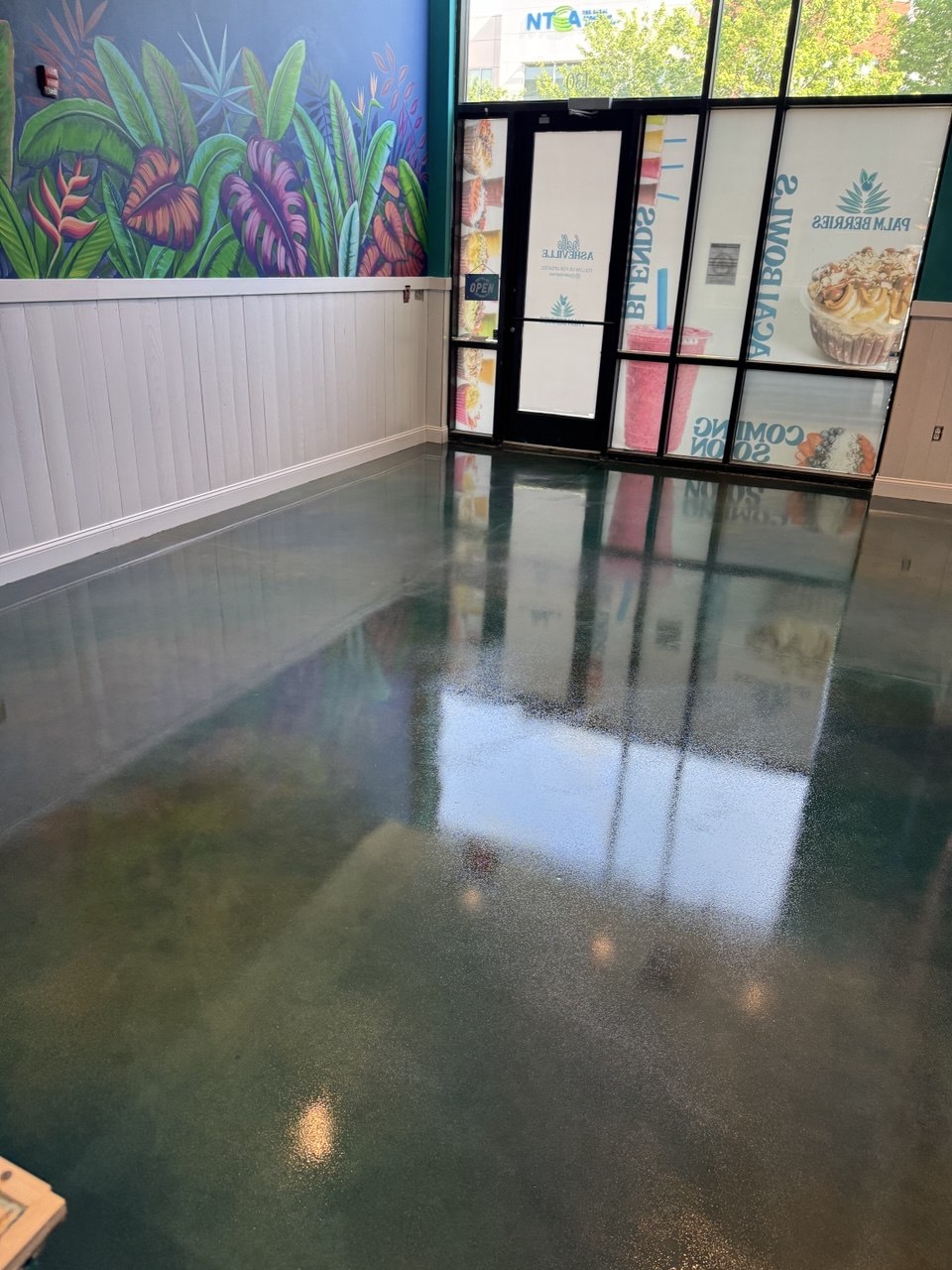 Teal stained floor in smoothie shop