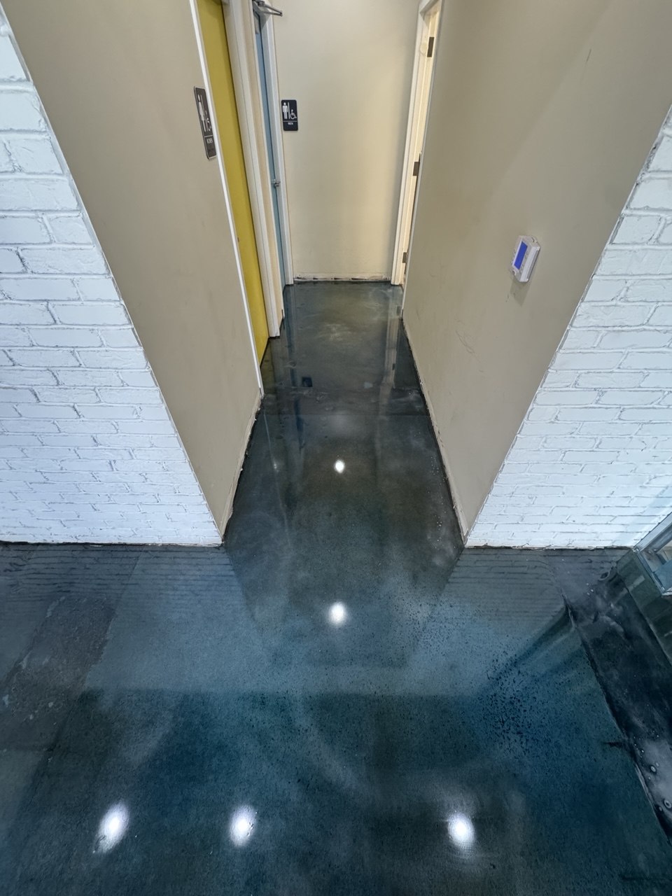 Blue stained concrete hallway