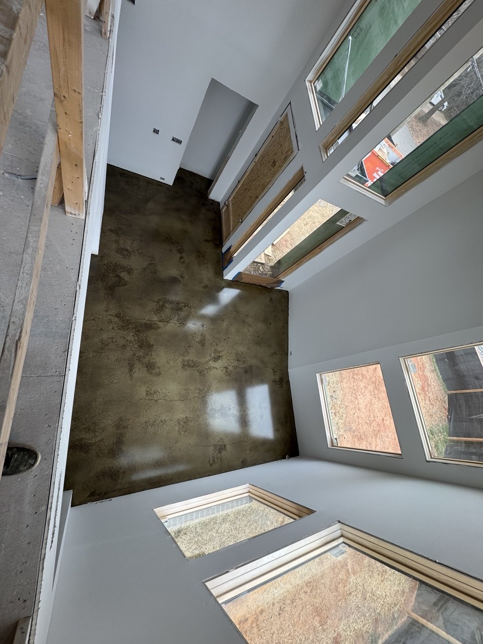 Olive stained accent wall and floor