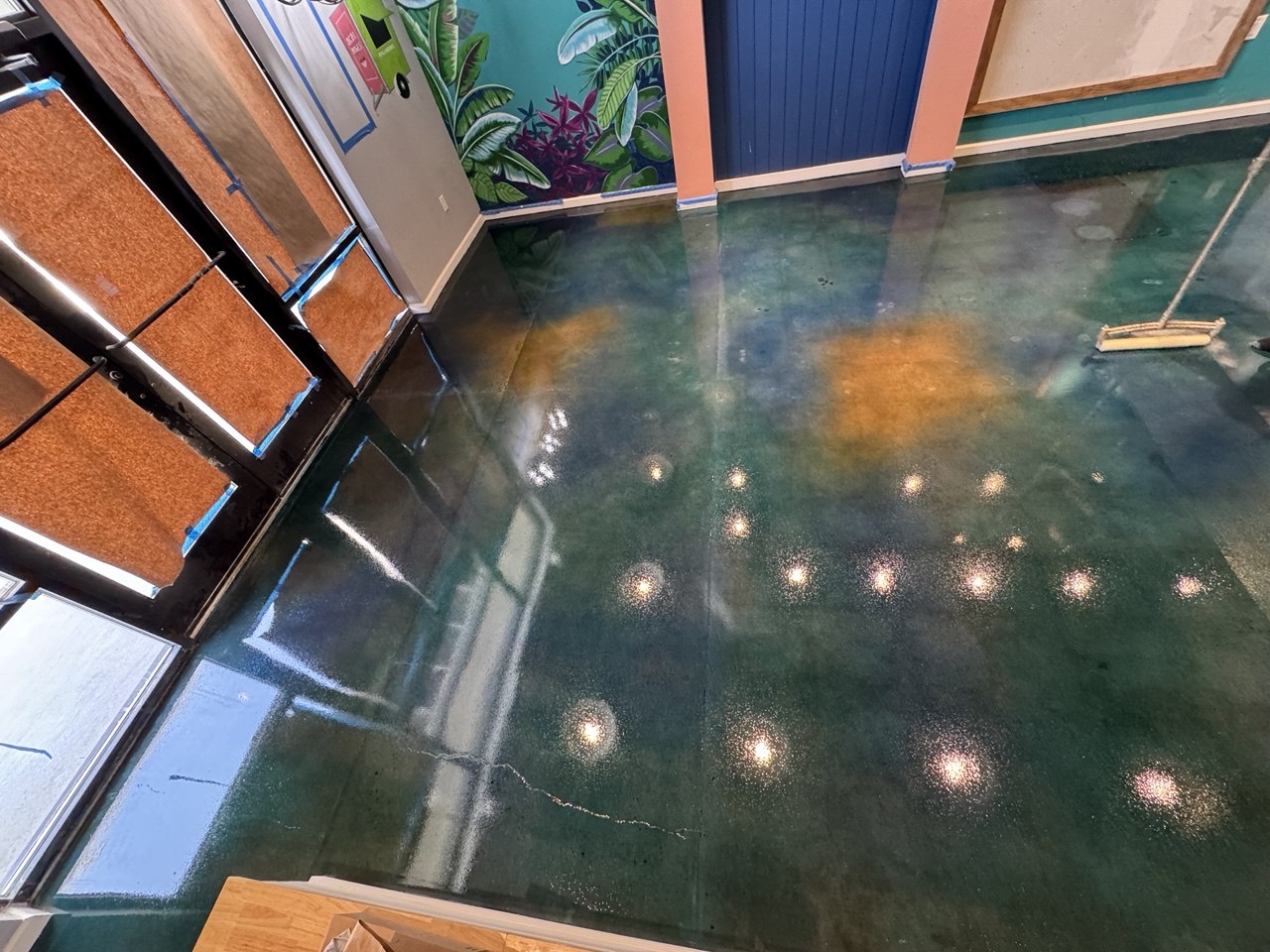 Teal stained concrete retail floor